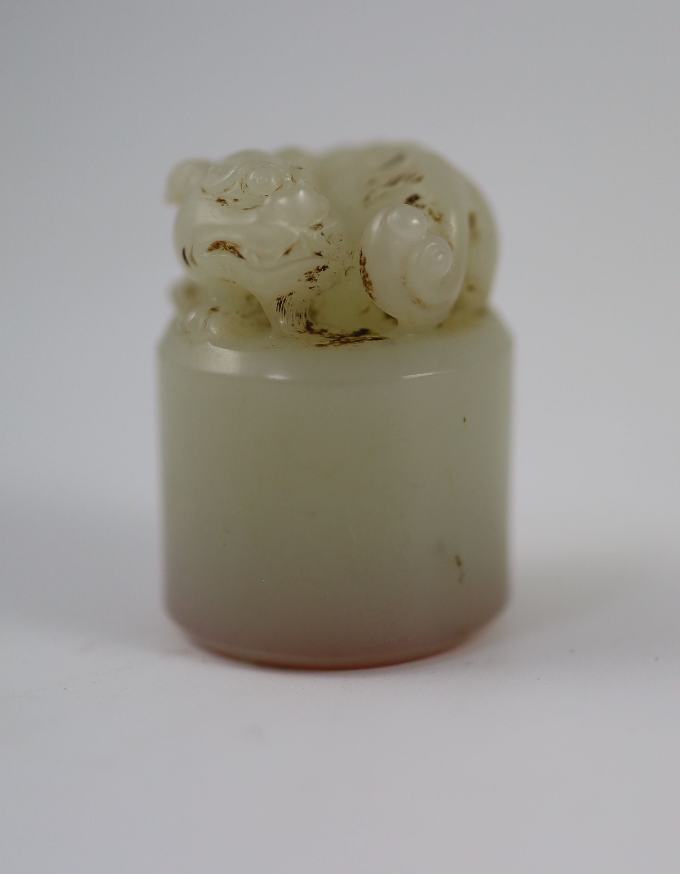 A Chinese white jade cylindrical seal, 3.5 cm high